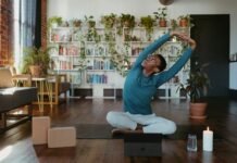 ‘마이크로 운동’ 바람, 일상 속 움직임으로 건강 챙기기 a man is doing yoga in a living room
