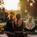 여성 건강관리, 작은 습관 변화가 만드는 큰 차이 a group of people sitting on top of a lush green field